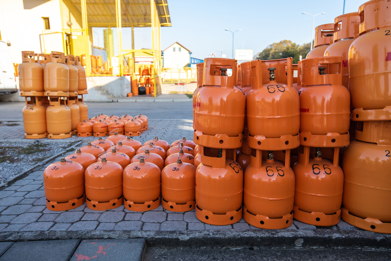 Orange LPG tanks arranged outdoor
